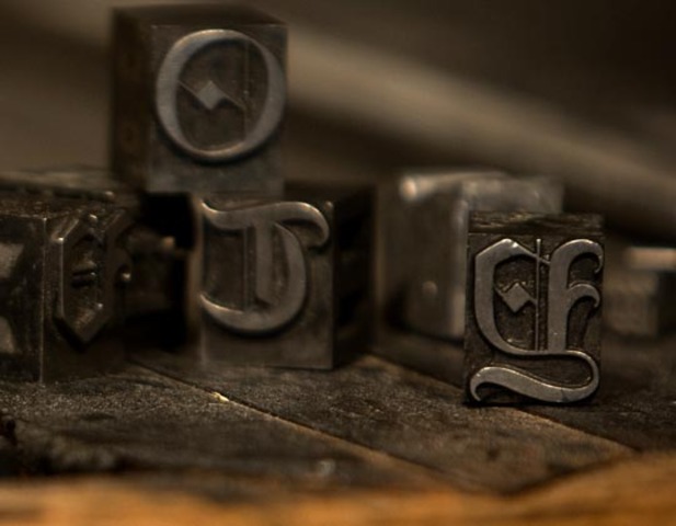 Johann Gutenberg invents a printing press using movable metal type