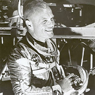 Astronaut John Glenn circles the Earth