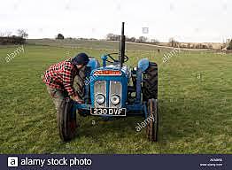 Watching my grandpa fix a tractor