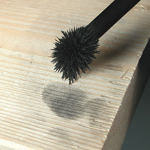 Henry Faulds presents powder dusting to expose quiescent fingerprints.