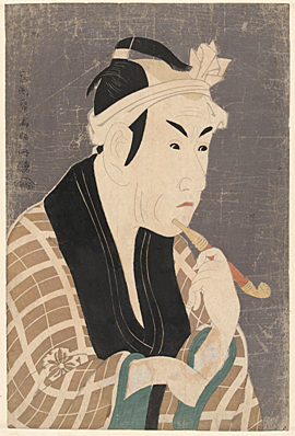 Imprenta con dibujos y caractéres tallados en madera