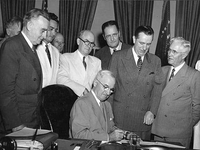 President Truman signs the Organic Act of Guam