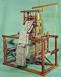 Premier métier a tisser programmable