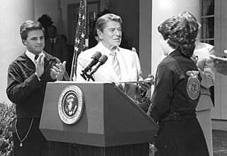 President Ronald Reagan speaks at the National FFA Convention via a prerecorded message.