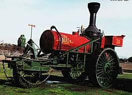 Tractor de vapor tipo triciclo con ruedas con tetones.