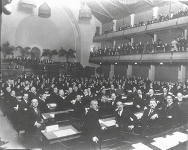Peace conference accepts principle of a League of Nations.