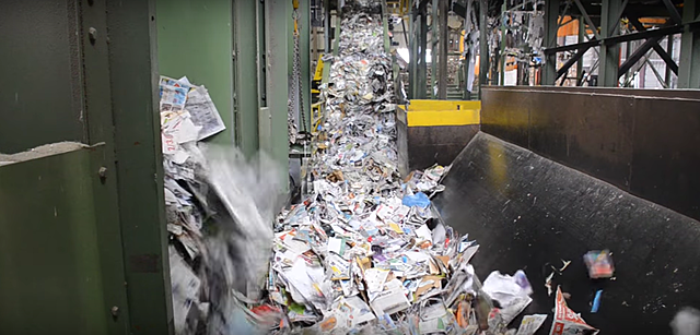 The paper is then sent to a pusher that moves it to a barrel