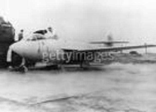 First person to fly a plane with rocket moyors