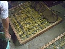 Panel con Aislamiento térmico utilizando totora, madera y reboque de mortero