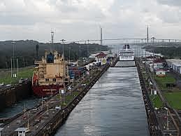 The Panama Canal is completed and opened for traffic
