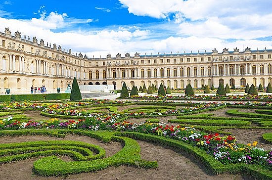 He expands the Palace of Versailles