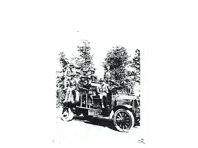 Photocopy of photograph of soldiers in some type of early automobile