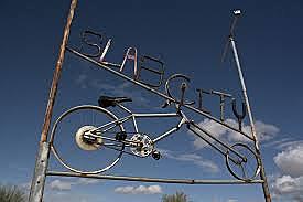 The Slabs was "an old navy air base that had been abandoned. It functions as the seasonal capital of a teeming itinerant society-a tolerant, rubber-tired culture comprising the retired, the exiled, the destitute, the perpetually unemployed (pg. 43).