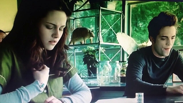 Bella starts at Forks High school and meets Edward Cullen