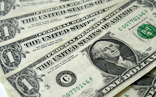 U.S. Adopts Dollar