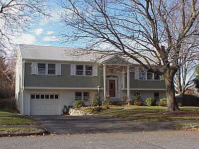The family moves to Regis Rd in Wellesley
