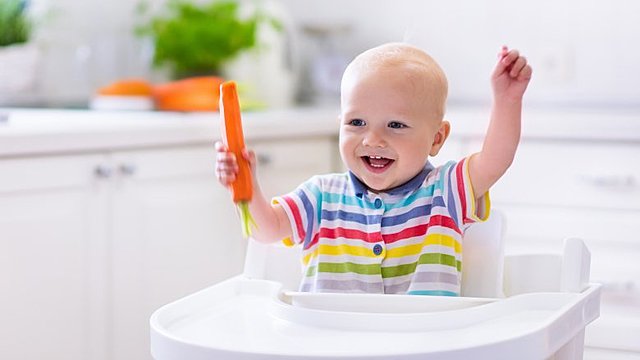 uses hands to reach, grasp, bang, splash, etc.