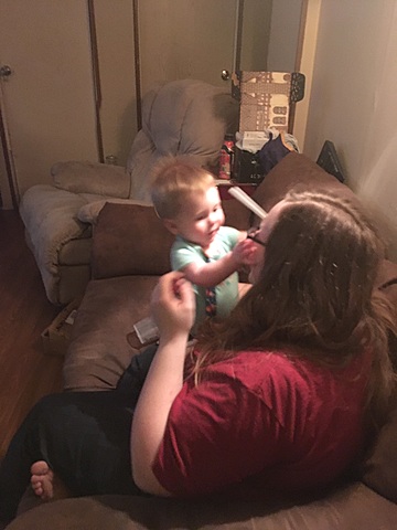 Pulls self up using furniture