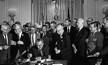 Civil Rights Act into law
