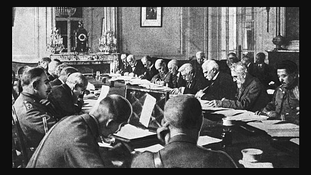 The Treaty of Versailles is signed, ending World War I.