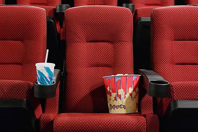 AMC put's Cup holders in arm rests