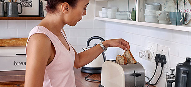 putting toast in toaster