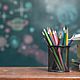 School books on desk  education concept 871454068 5b548900c9e77c005b04fc8c