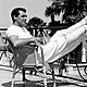 Cary grant lounging feet up sitting in chair history mens fashion style 800x533