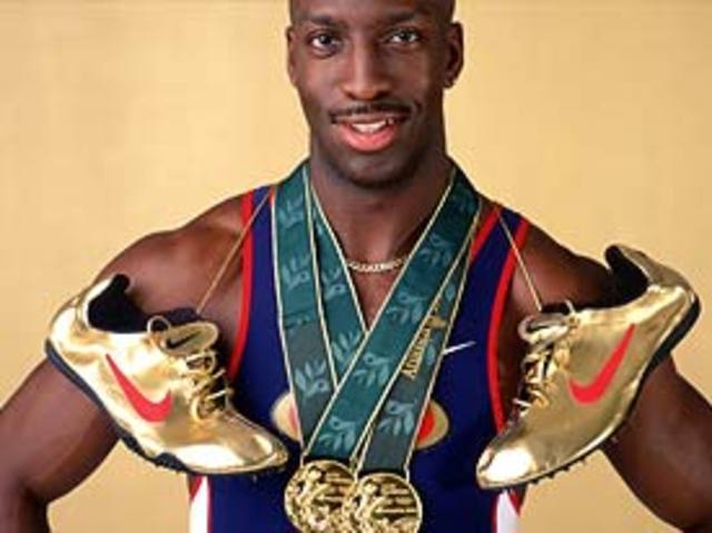 Michael Johnson breaks the 400 metres world record