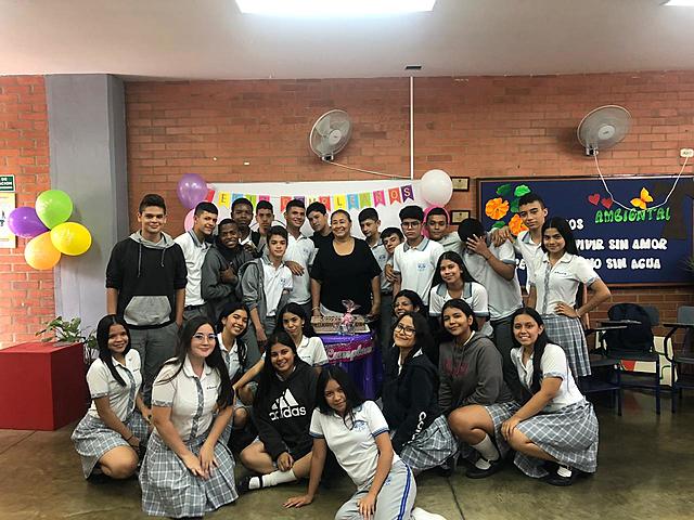 Me and my classmates with our group director celebrating her birthday