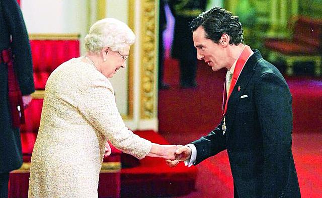 Benedict Cumberbatch receives a medal of honor from Queen Elizabeth II