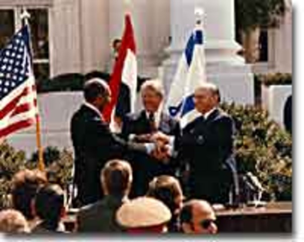 Jimmy Carter negotiates the Camp David Accords to promote peace in the Middle East