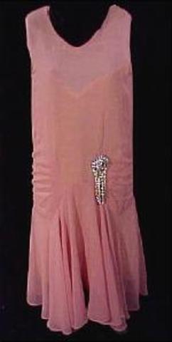 waved hair and bobs became popular, flattening bras became "en vogue" and "flappers", make-up was essential, also the sizing-system was developed and put to use, tan skin became popular