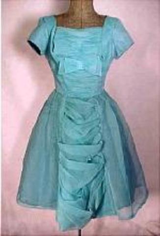 two-piece skirts and blouses, beaded evening sweaters, black leather jackets (for teenager), cork shoes are in and tinted foundation mixed with eyeshadow, hair was worn either in a ponytail, a bun or a beehive, sometimes it was cut short, uplift bras, gir