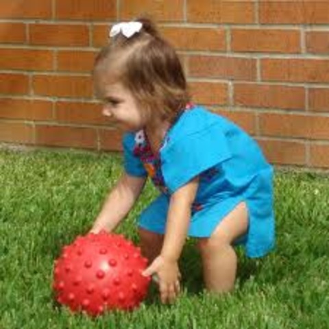 throws ball overhand&kicks it forward (21 mnths)