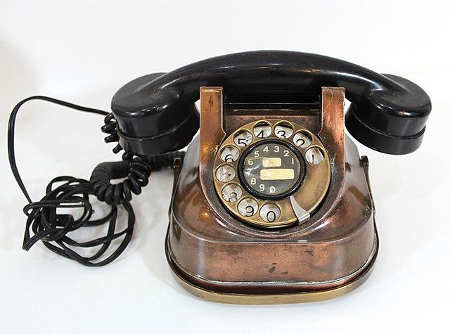 The first  telephone with a handset