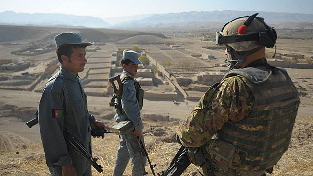 2010 NATO agrees plan to hand full control to Afghan security forces by 2014