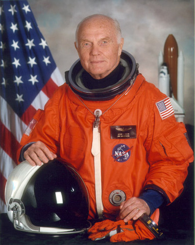 John Glenn orbits the Earth three times.