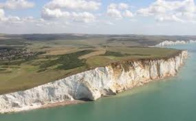 A large piece of the chalk cliff at Beachy Head collapses into the sea