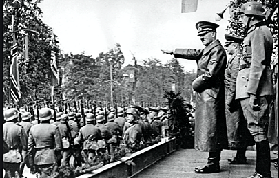 Hitler annexes the country of Austria into Germany, Called the Anschluss.