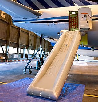 Inflatable escape slide and raft