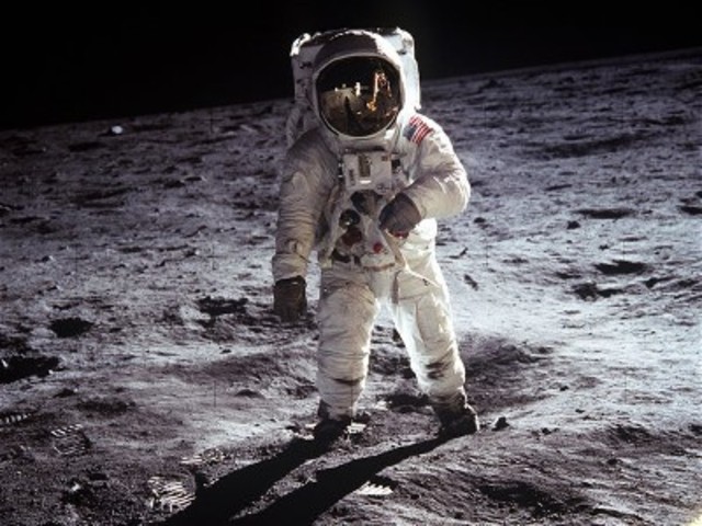 Neil Armstrong and Edwin "Buzz" Aldrin become the first men to walk on the Moon