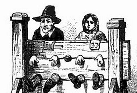 Puritan assemblies and activities outlawed