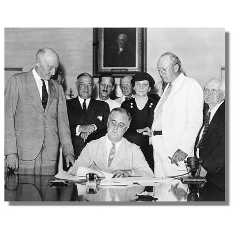FDR signs the Social Security Act