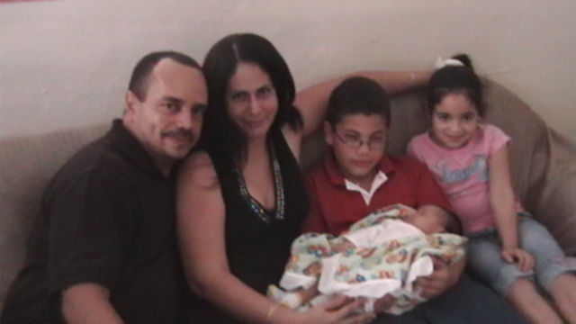 with my uncles at 2 mths.