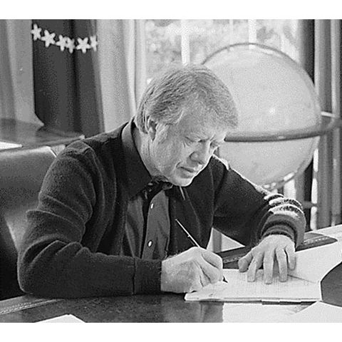 President Jimmy Carter signs the Full Employment and Balanced Growth Act (Humphrey-Hawkins Act)