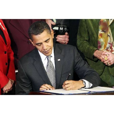 President Barack Obama signs a six-month extension of unemployment benefits.