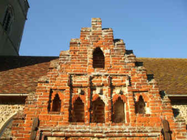The brick church porch is Tudor (16th Century)
