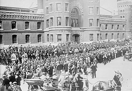 Members of Canada's 48th Highlanders Regiment, with the 12th Infantry and 10th Royal Battalions, depart an armory in Toronto.