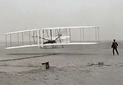 First engine powered flight